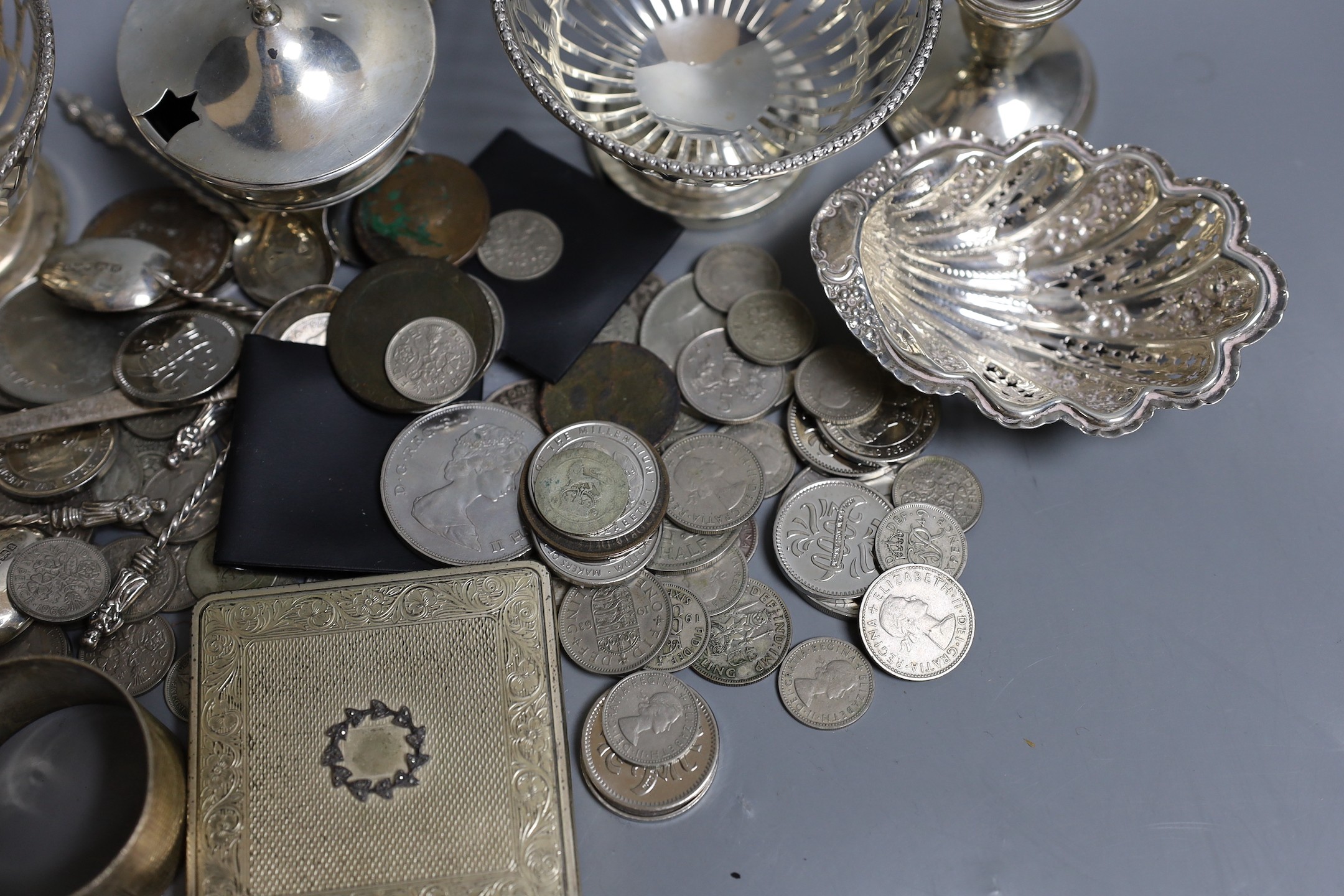 Mixed silver items including a pair of George V pierced silver bowls, weighted, a pair of pierced silver shell dishes, a pair of dwarf candlesticks, a silver napkin ring and other items including compact and assorted coi